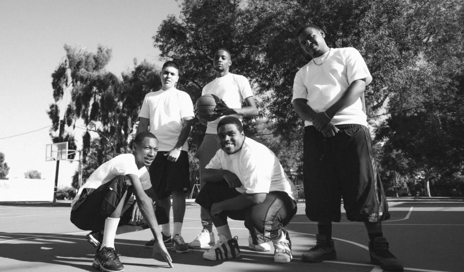 Black-and-white photo of young men on a basketball court — Pro Club's 1980 origins
