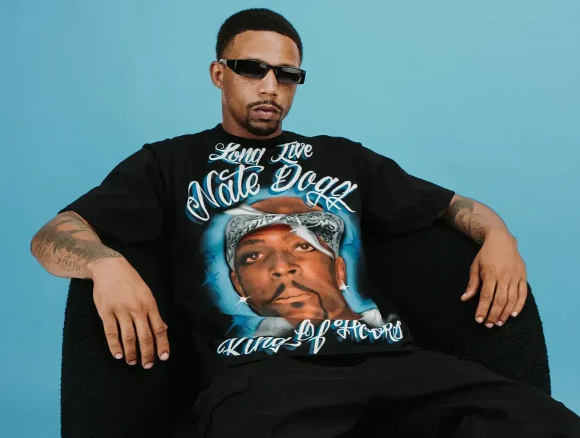 Man wearing a Pro Club 'Long Live Nate Dogg' graphic tee