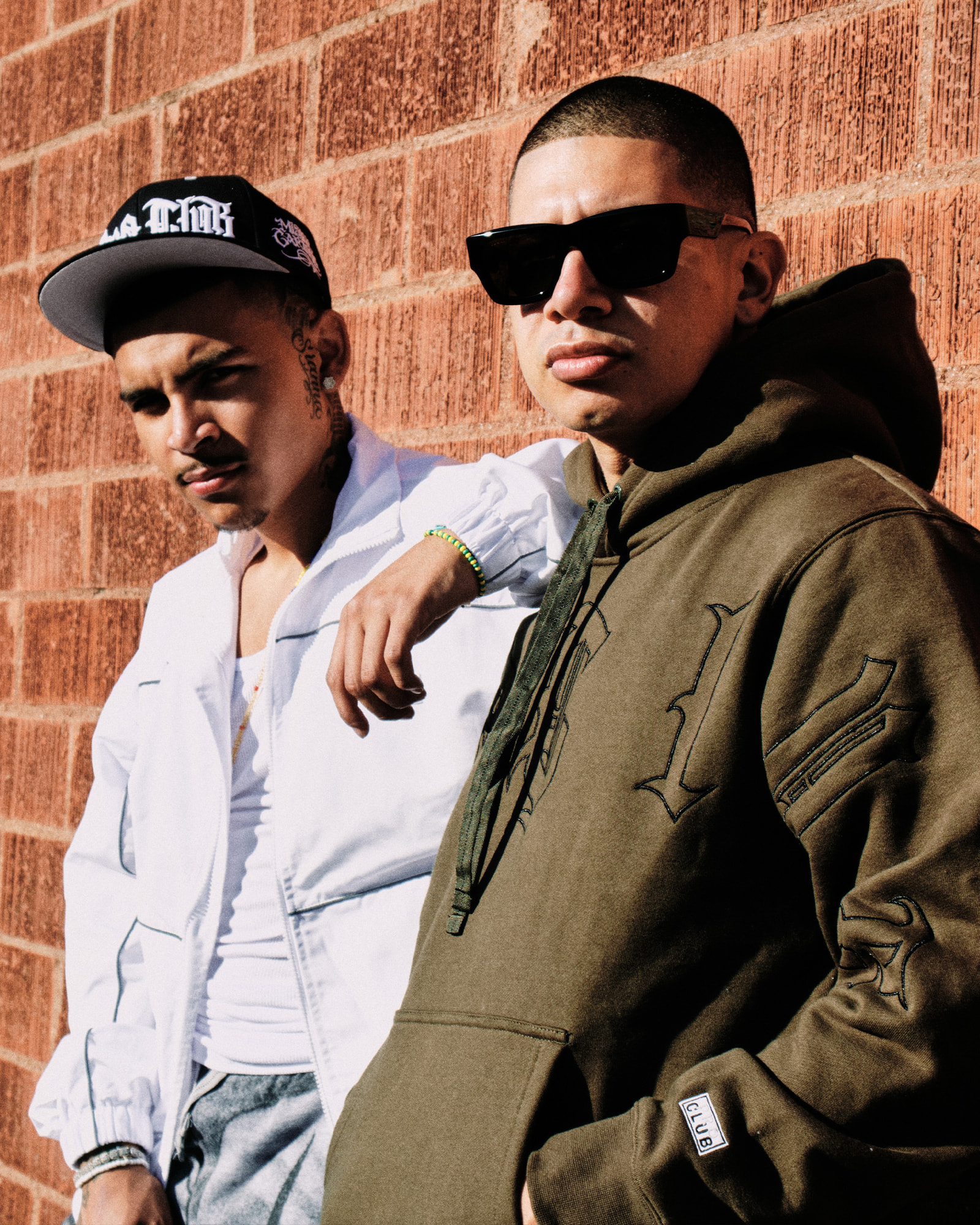 two men in mister cartoon x proclub hoodie & shirt