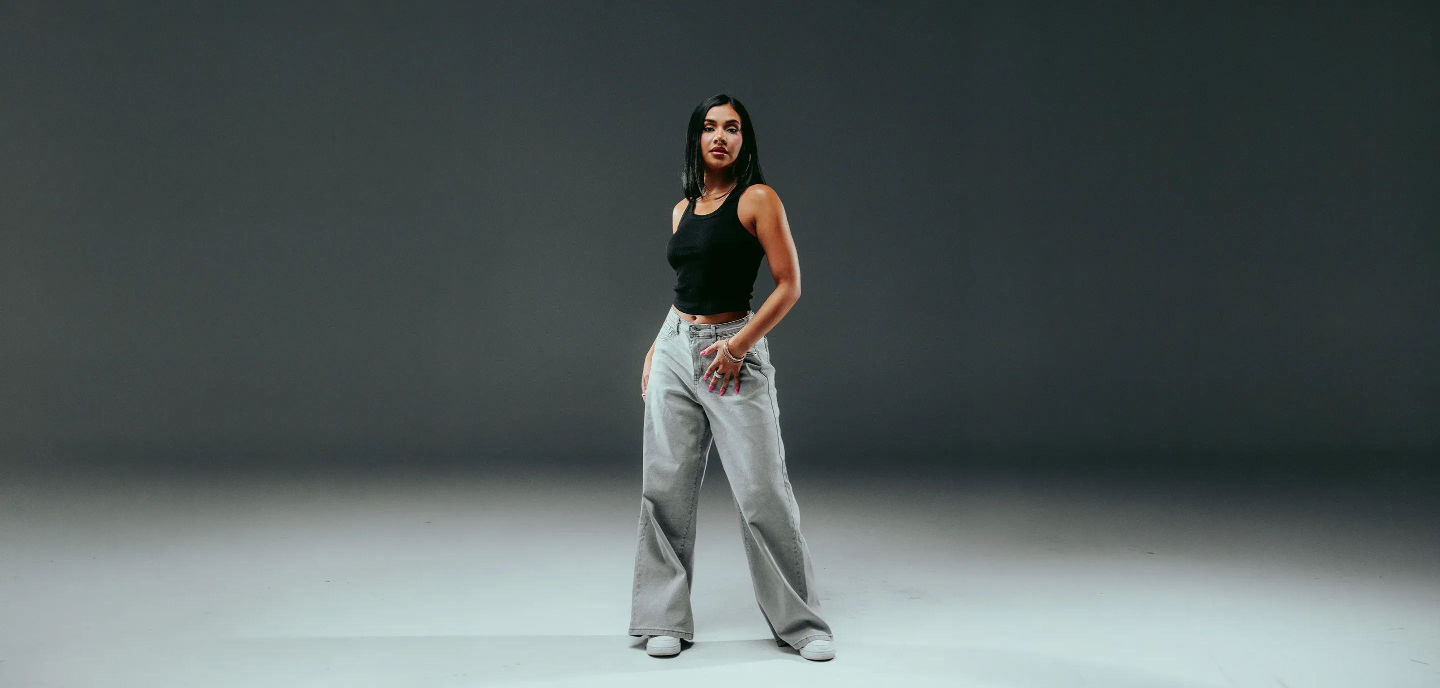 Person in wide-leg denim jeans - shop women's bottoms