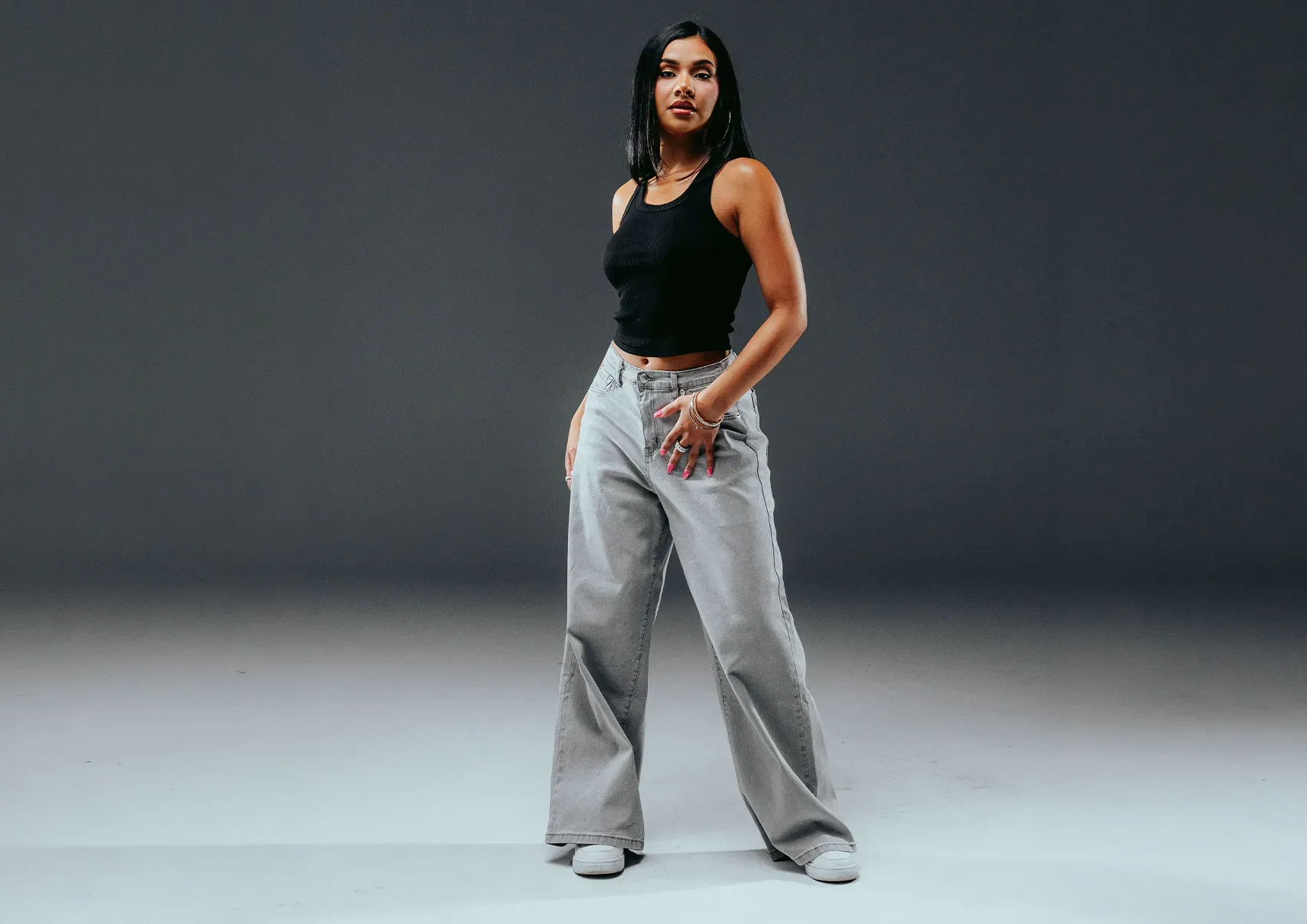 Person in wide-leg denim jeans - shop women's bottoms
