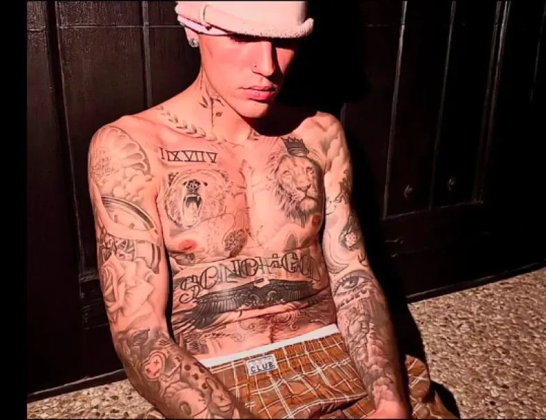 Justin Bieber in a pink cap and Pro Club plaid boxers