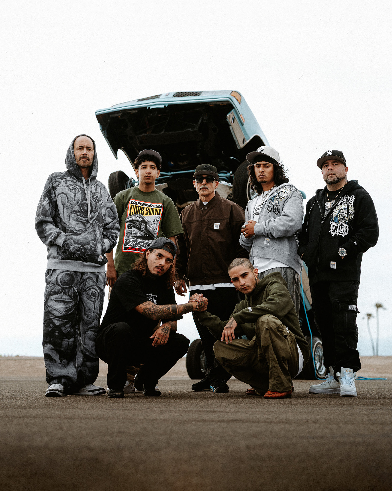 Group in mister cartoon x proclub hoodie 
