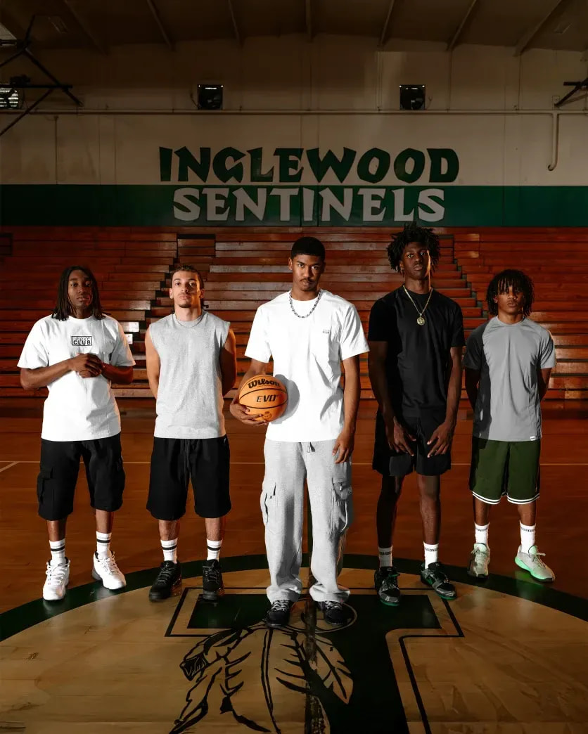 Five men in white Pro Club tees on an Inglewood Sentinels basketball court